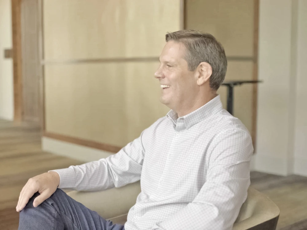Todd Kale smiling as he engages with client