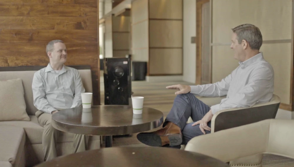 Client drinking coffee with Todd Kale of Baron & Budd