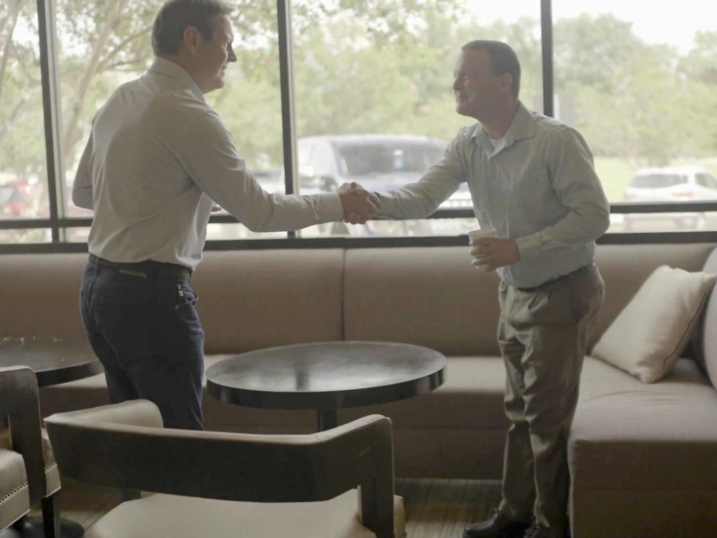 Client shaking hands with Todd Kale of Baron & Budd